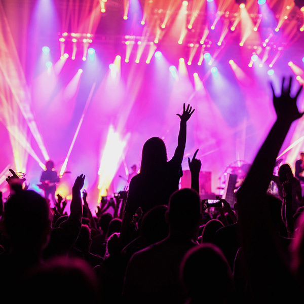 Blurry of silhouettes of concert crowd