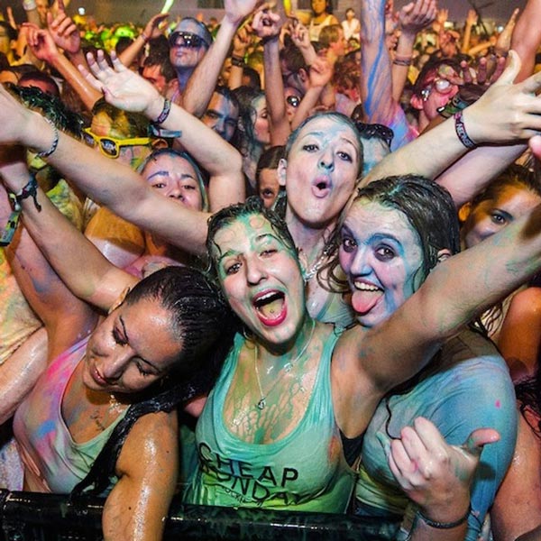 festival crowd covered in paint